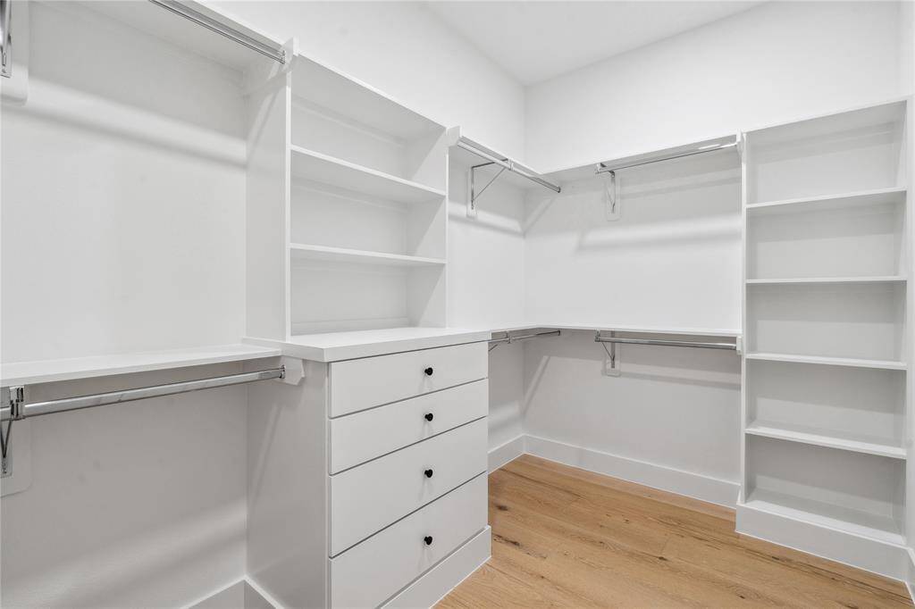 And a rare, finding bungalows a walk-in closet with custom shelves and drawers.