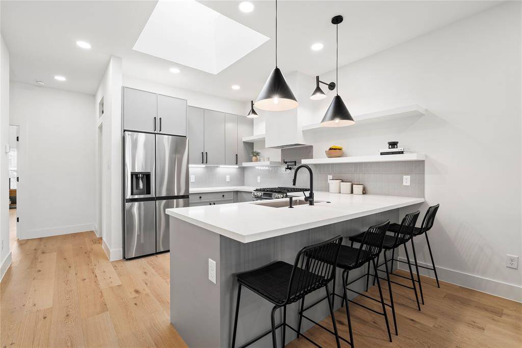 Vecino homes completes a stunning bungalow remodel taken down to the studs with interior styled by Viarq Designers.