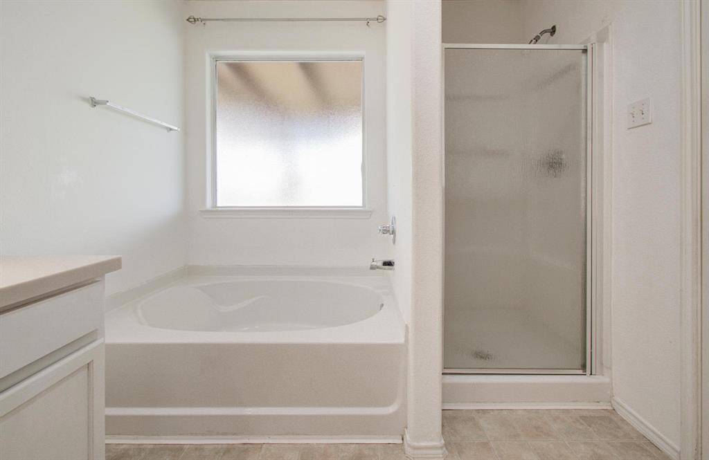 Primary bathroom with separate soaking tub and shower