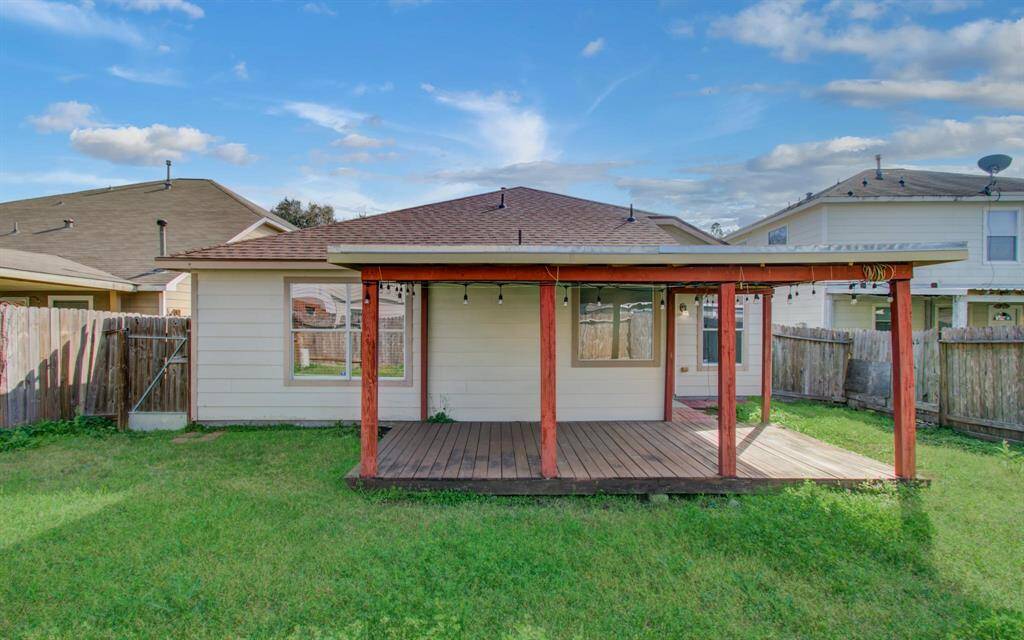 Spacious backyard with covered patio