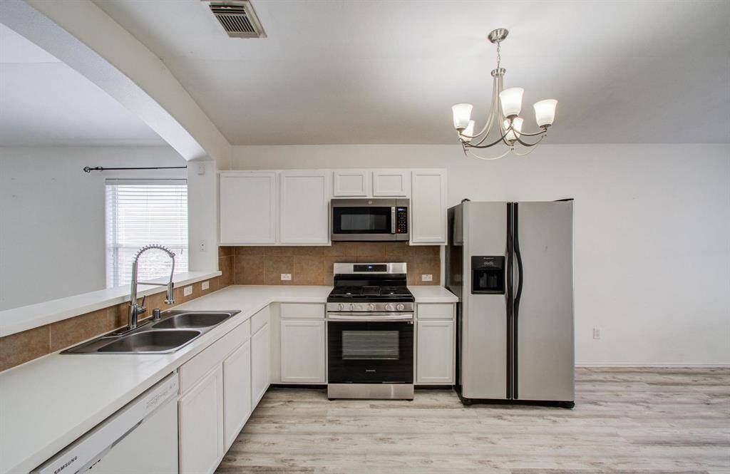Kitchen with updated stainless steel appliances