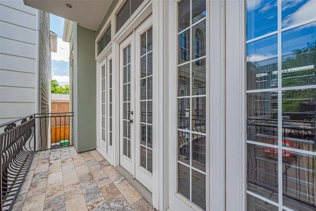 Enjoy private outdoor living from the upper-level balcony, accessible through double doors—offering room to unwind.
