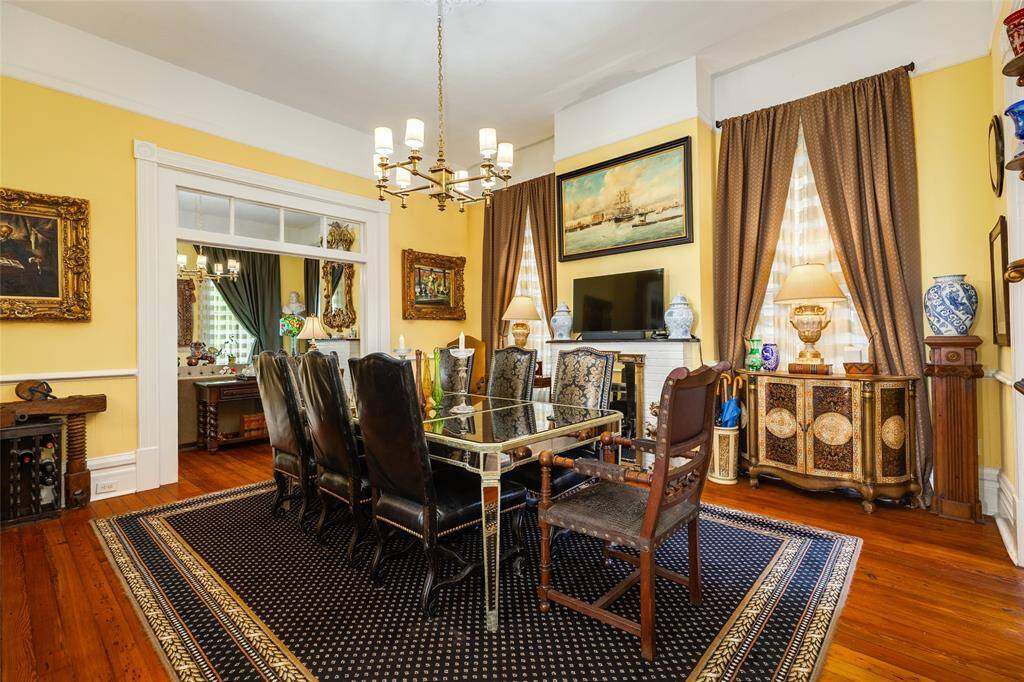 Dining space with Chandelier from historic Hotel in Galveston.  Ornate fireplace with gas connections.l
