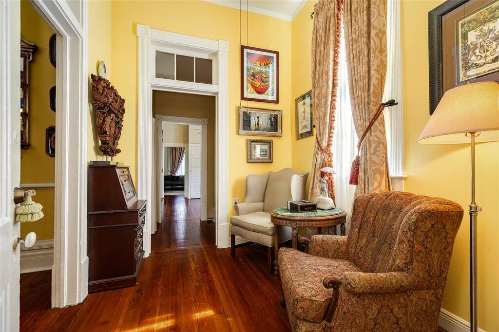 Reading nook that leads flows off foyer and dining area that continues to back bedroom that could be primary bedroom or separate guest quarters that could be closed off as apartment for long term rental or Airbnb.