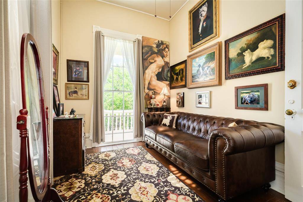 Upper level reading nook or study with entrance to front balcony.