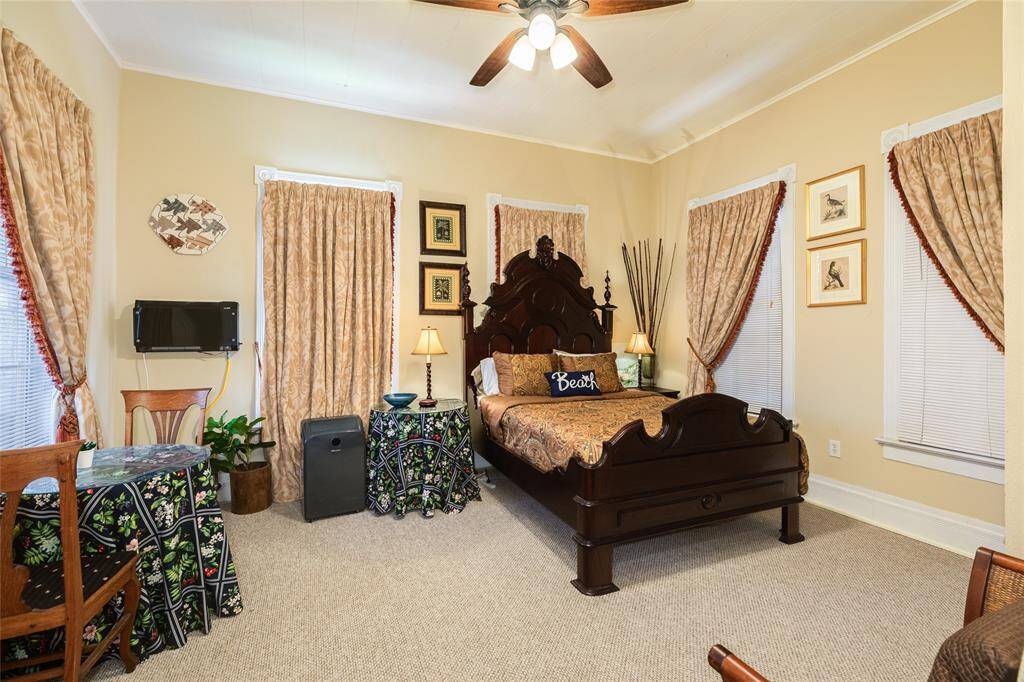 Spacious bedroom located on the upper level that has separate entrance to home.  Can easily go back to being incorporated into Main house and used as Primary bedroom suite.