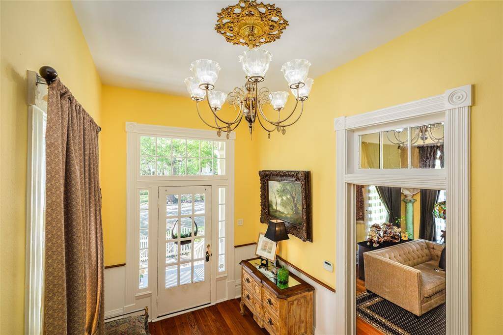Foyer with beautiful ornamental ceiling medallion and Chandelier from Historic Hotel.