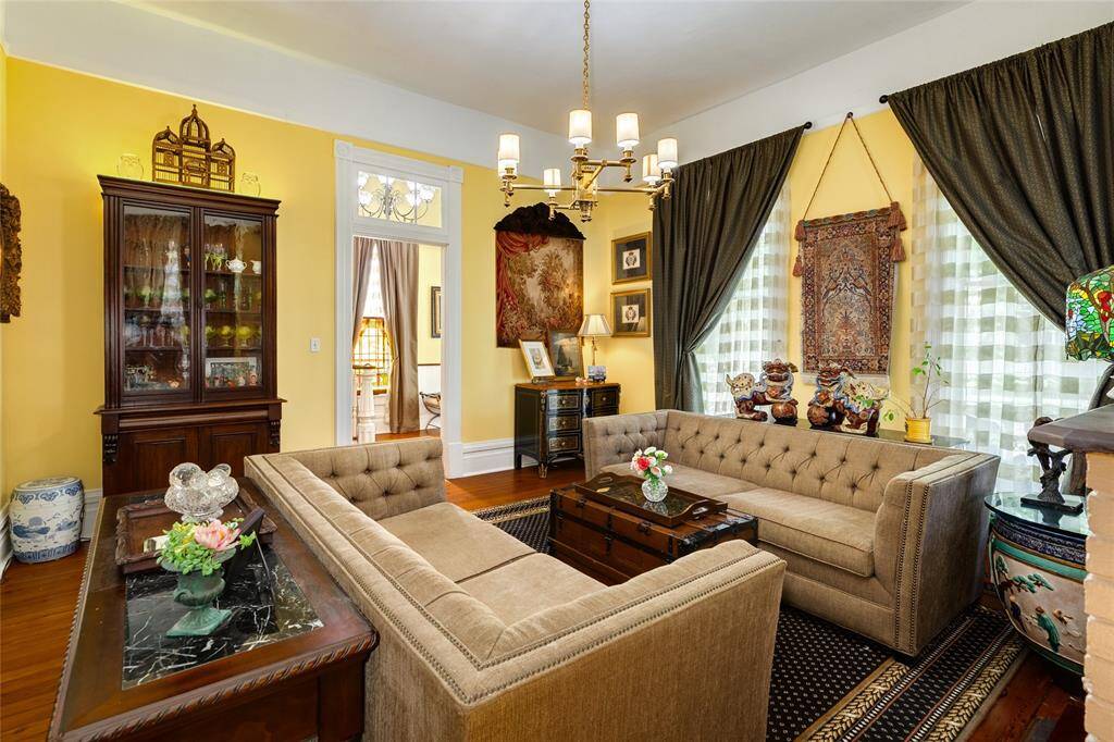 Living area with entrance to foyer. Check out the beautiful transoms above the entrance.