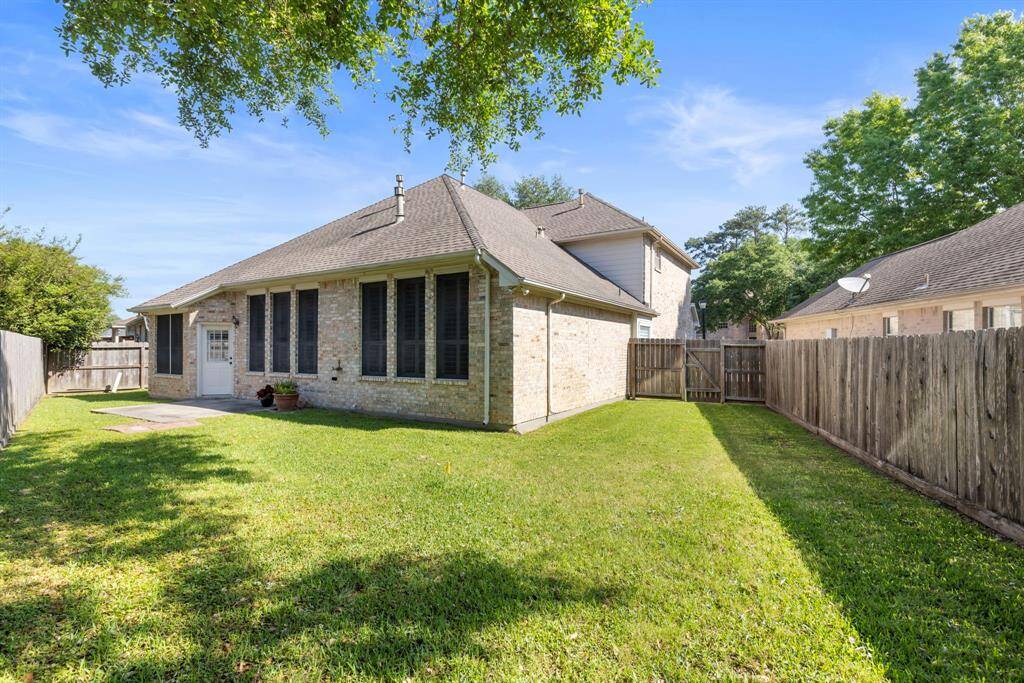 Large pie shaped lot provides tons of space in this backyard.