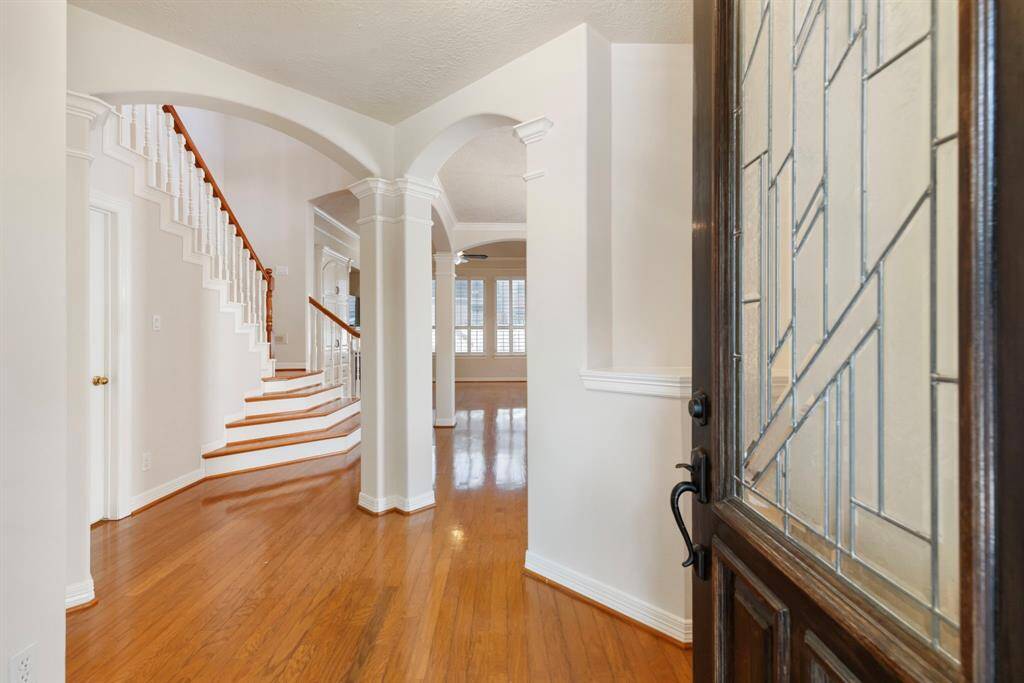 Stunning hardwood floors, neutral paint and eye-catching architectural details from the moment you enter this home.