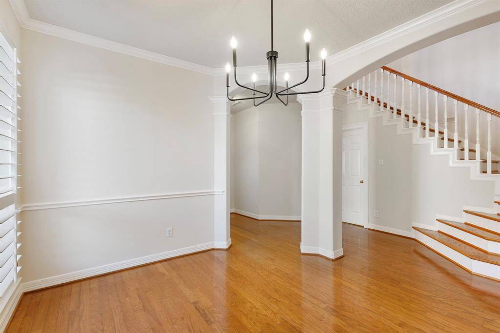 This large dining room is great at accommodating for large dinner parties and is just a step from the kitchen.