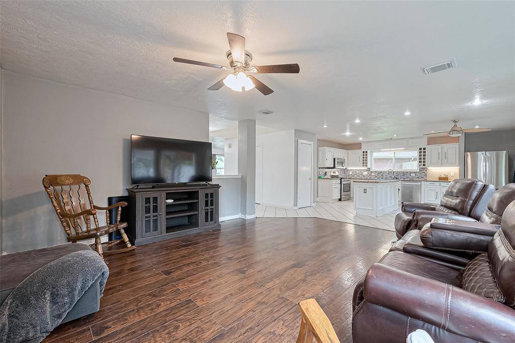 Family room opens to kitchen and additional dining area