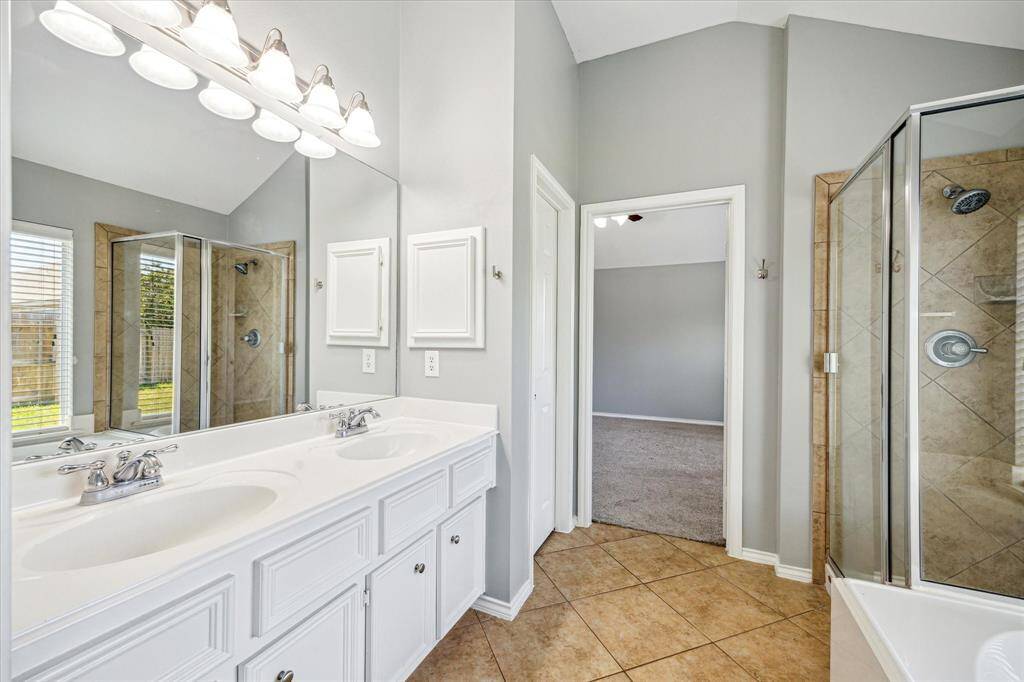 Another View of the Primary Bath Exhibiting the Storage Space and Upgraded Fixtures