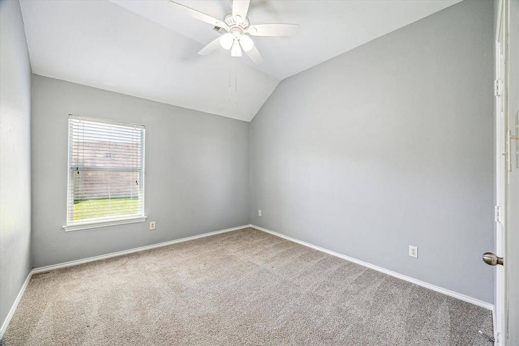 The Second Bedroom with Fresh Paint, Plush Carpet, Ceiling Fan and Natural Light