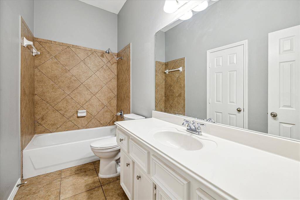 The Second Full Bath Has Ample Counter & Storage Space for The Kids and a Tub / Shower Combo.