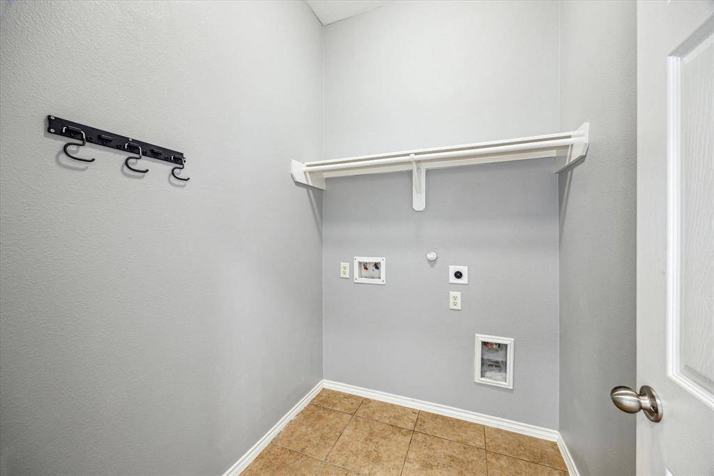 Separate Laundry Room Near The Primary Bedroom Suite