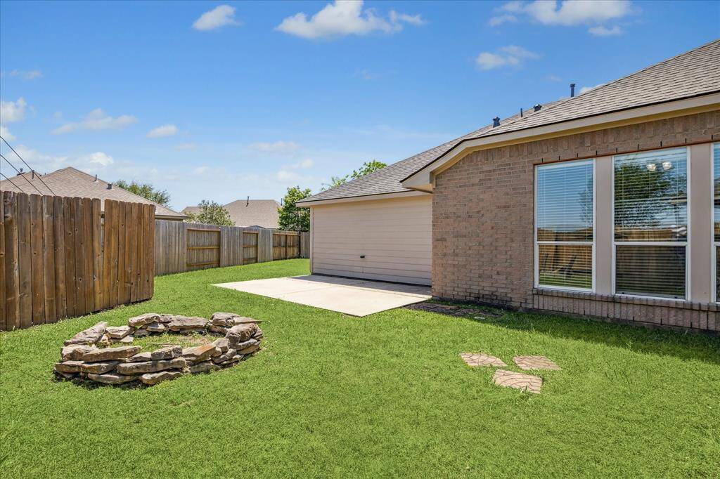 Side Yard w/ Space to Gather Around the Fire