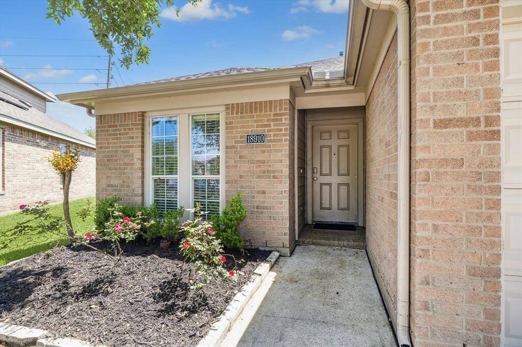 Full Brick Front with Wood Front Door Welcomes You Inside
