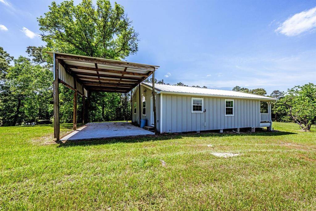 Attached to the 3rd house is a covered parking area, big enough for an RV