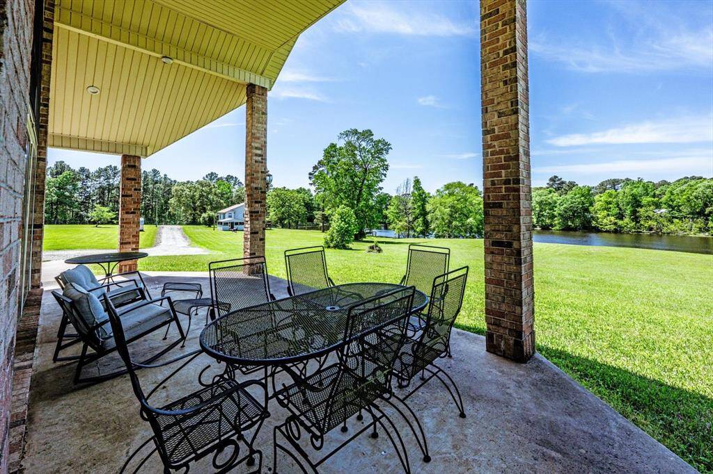 Main house patio overlooking the 7 acre lake
