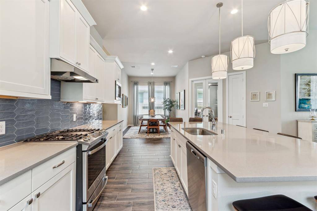 Plenty of room between the island and gas oven/stove top. BLue tooth Stove that you can turn on from your phone!