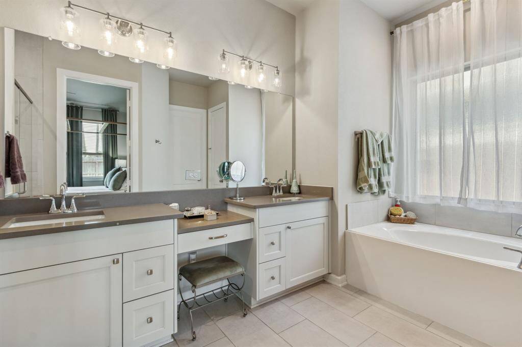 SPA Primary Bath features double sinks, garden soaking tub and an oversize shower with double heads