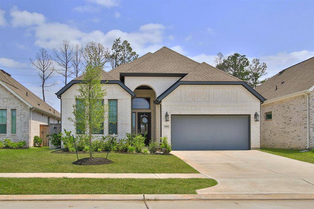 Well maintained yard and flower beds