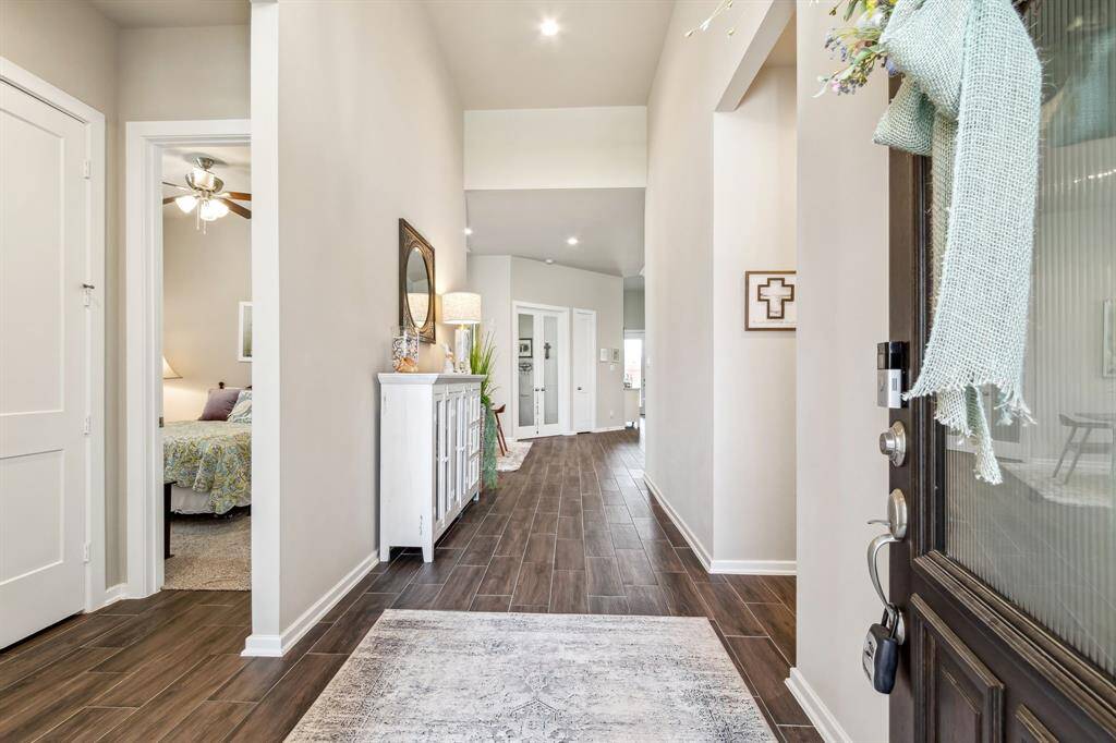 Cermamic Wood tile throughout the living, dining, office, and kitchen