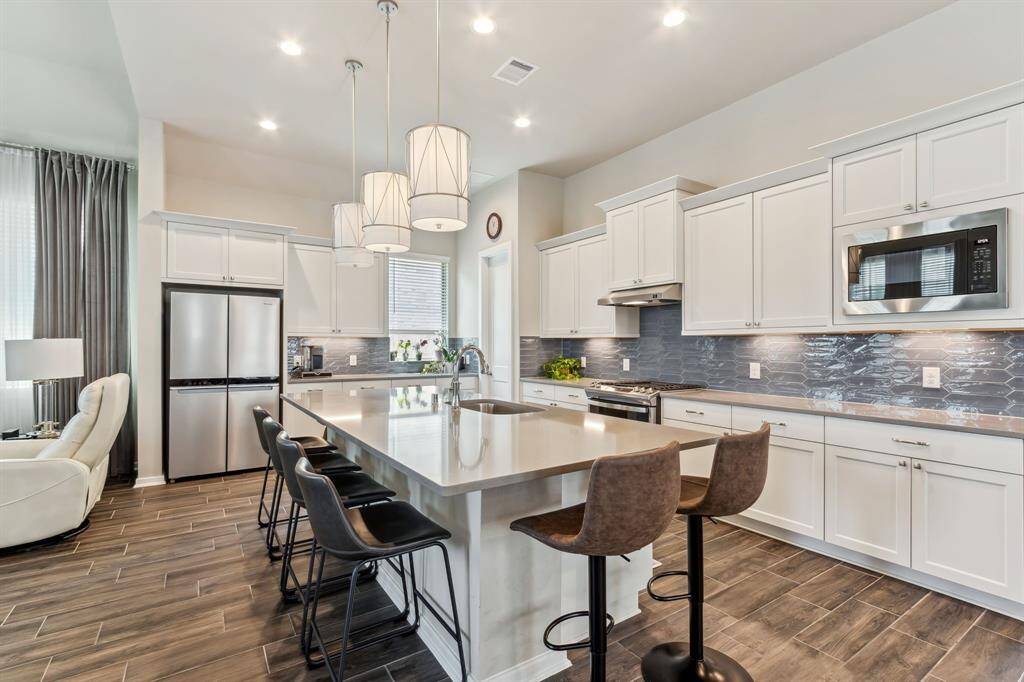 Separate MicrowaveExtra shelving in all the upper cabinets, and pull outs have also been added to the lower cabinets