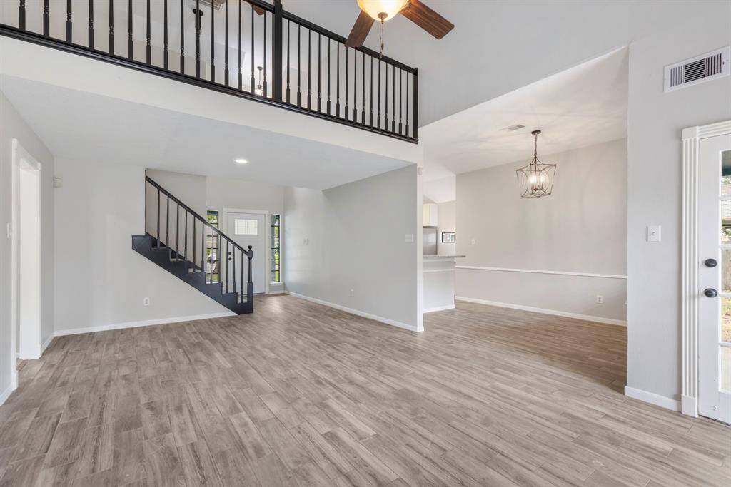 Welcome your guest to the inviting covered wrap-around front porch