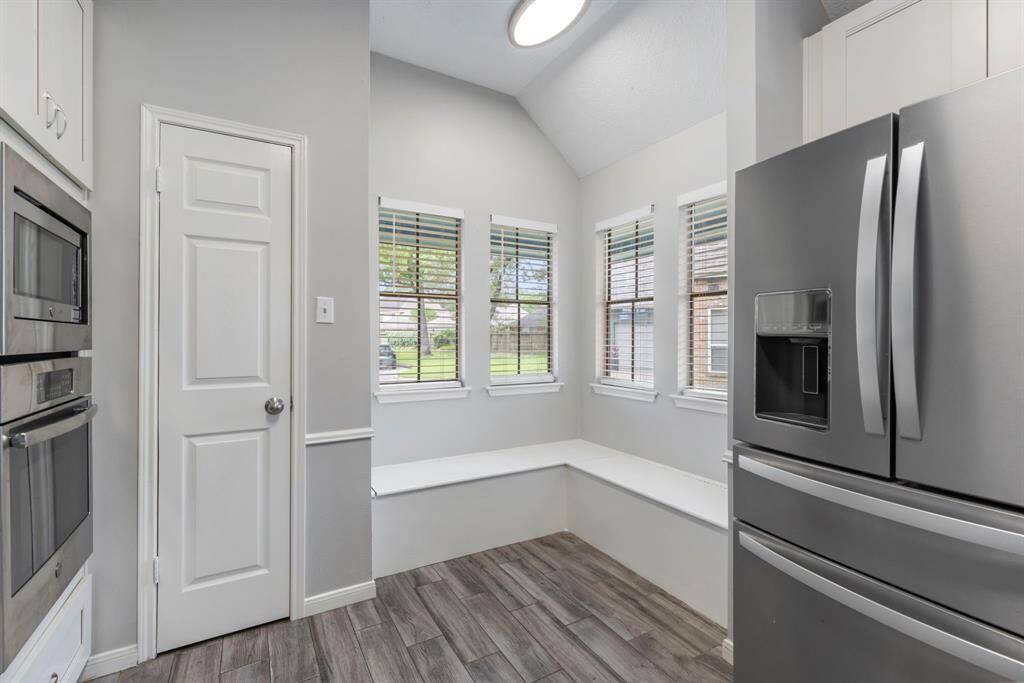 Granite countertops with ample counter space, perfect for meal preparation and entertaining