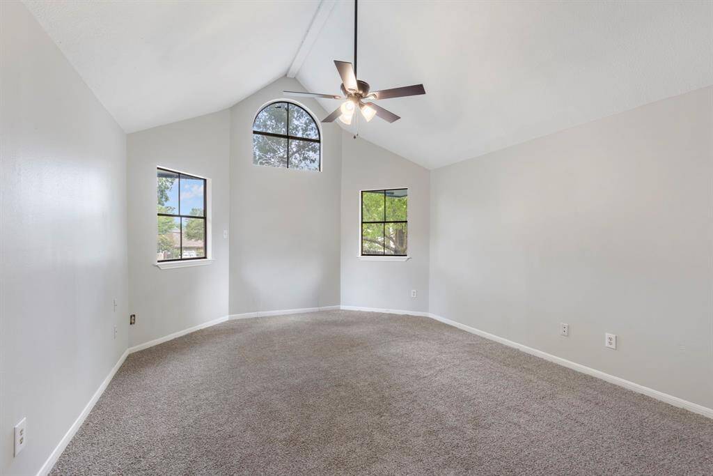 The game room overlooks the stairs and the living room offering a cozy and elevated space