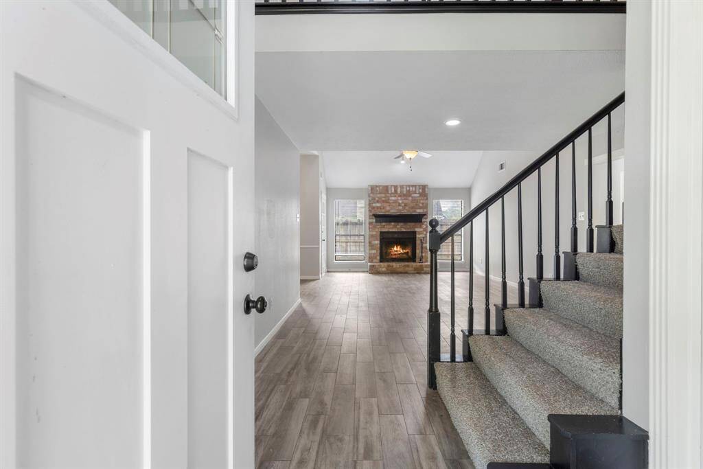 A welcoming home featuring a double-wide driveway and a spacious two-car garage, offering ample parking