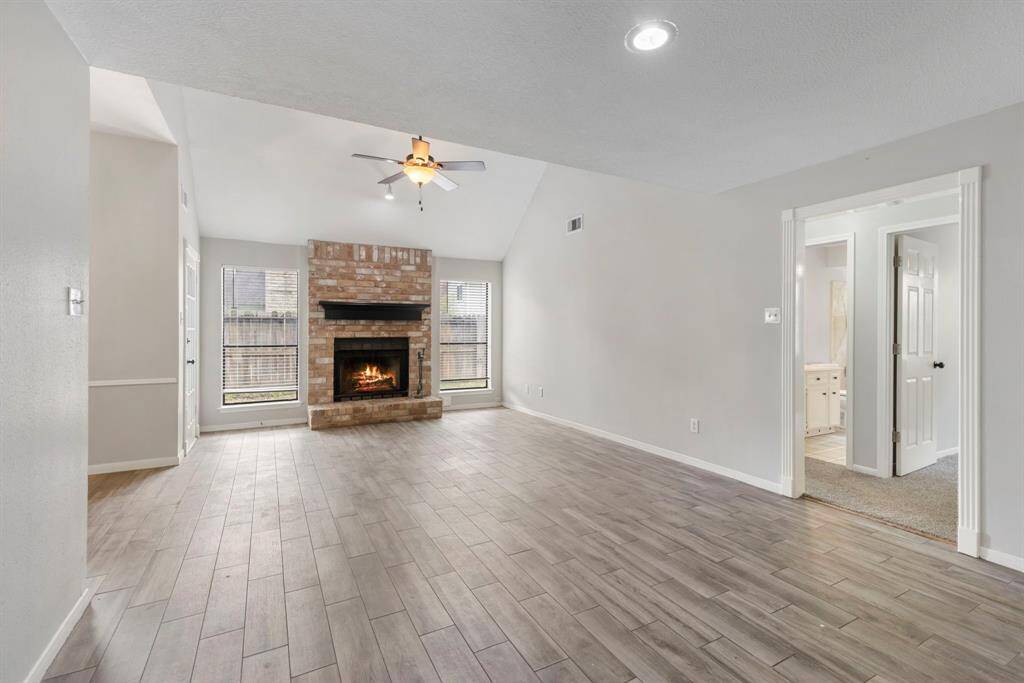 This home offers a serene retreat with its abundance of large shade trees providing tranquility and natural beauty