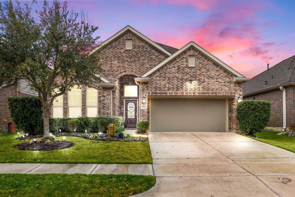 Welcome home to 19614 Red Copper Lane located on a quiet street in Towne Lake and zoned to Cy-Fair ISD! This stunning home has lovely curb appeal, a well-manicured lawn, beautiful landscaping, brick elevation, dark stained front door with glass detailing, covered front porch, traditional style, beautiful outdoor lanterns and a double wide driveway.