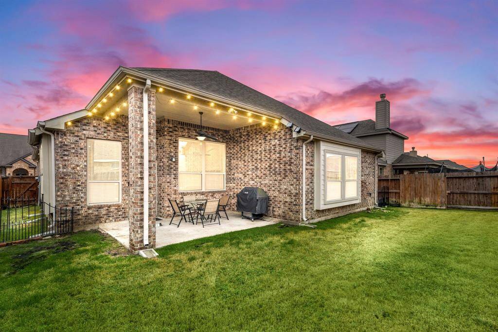 Come and see this spacious backyard with its beautiful covered patio. There is plenty of room for the kids to play and adults to relax!