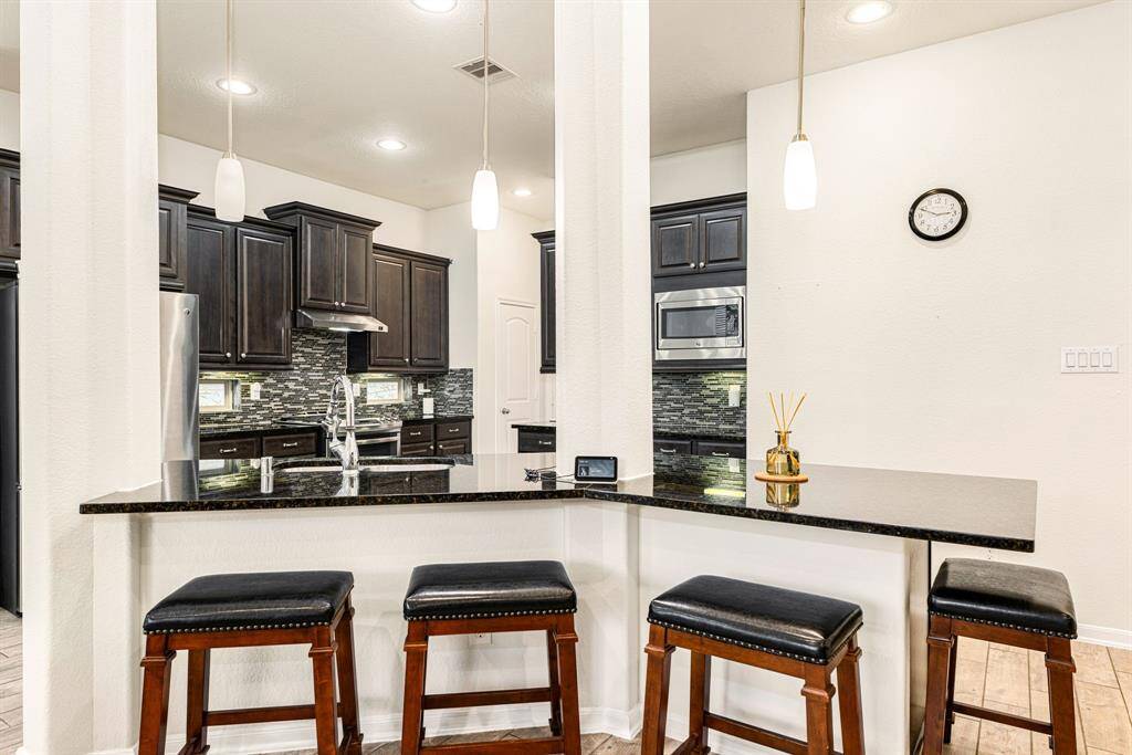 Any chef's dream, this stunning kitchen is perfect for everyday life as well as entertaining family and friends! Extra large kitchen island is perfect for conversation or that much needed space to lay out your party spread for everyone to enjoy!