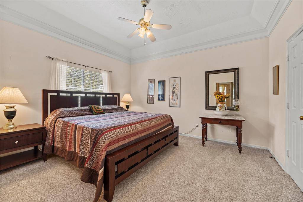 Second bedroom measures 12.7 x 15.5 is located on the second floor. It features carpet flooring and a ceiling fan.