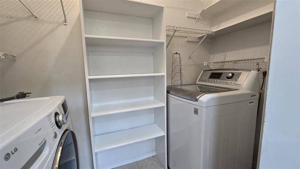 Laundry: Convenient in-unit laundry room with space for full-size appliances and extra shelving.
