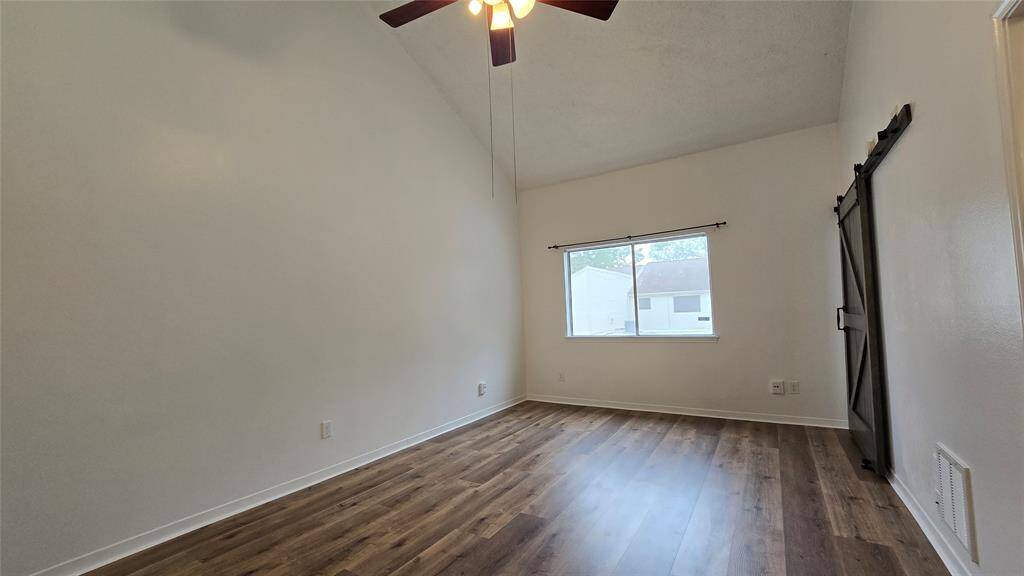Primary Bedroom Spacious and private with en-suite bath and walk-in closet.