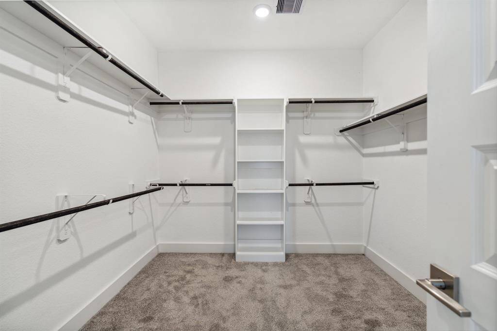 The primary closet is an impressive 10' by 9' size and provides tons of storage space.