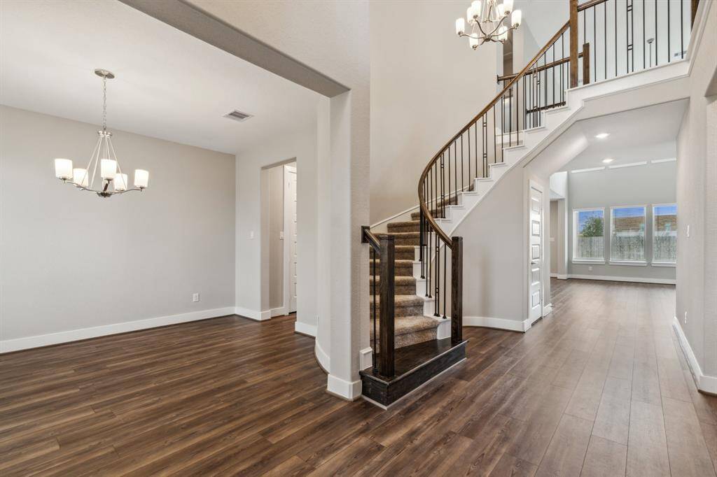 This is the view from the foyer into the spacious dining area which is also connected to the kitchen via a hallway