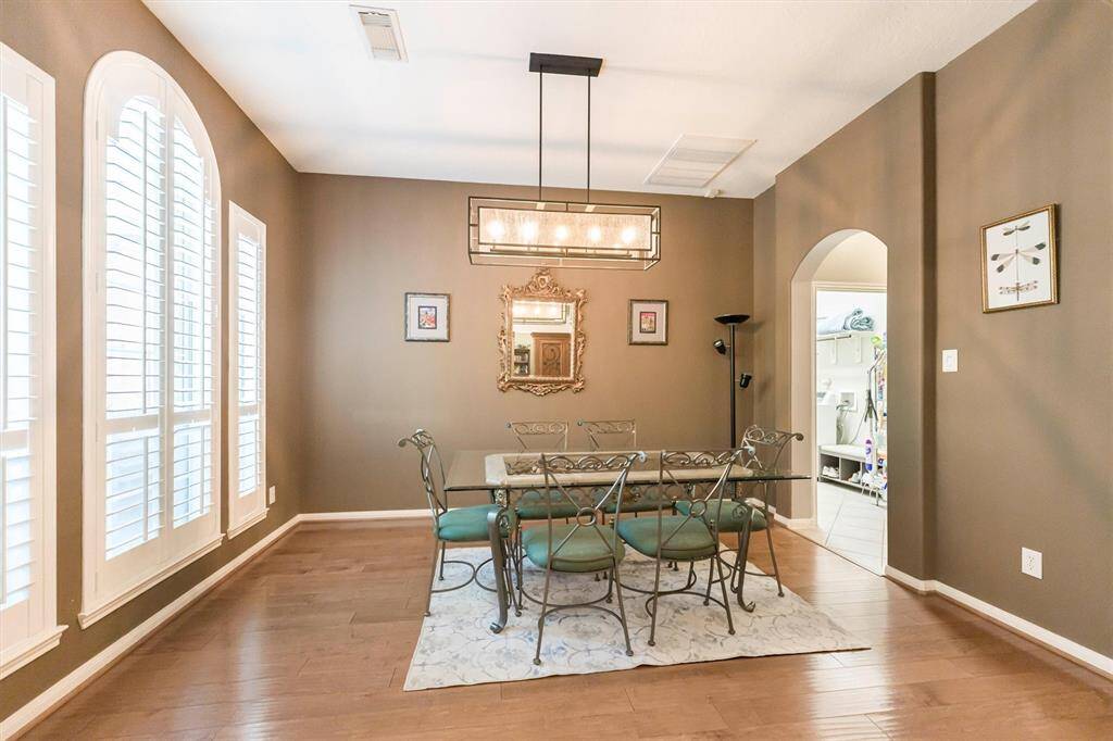 Living area with a wall of windows overlooking your Private Backyard Oasis...