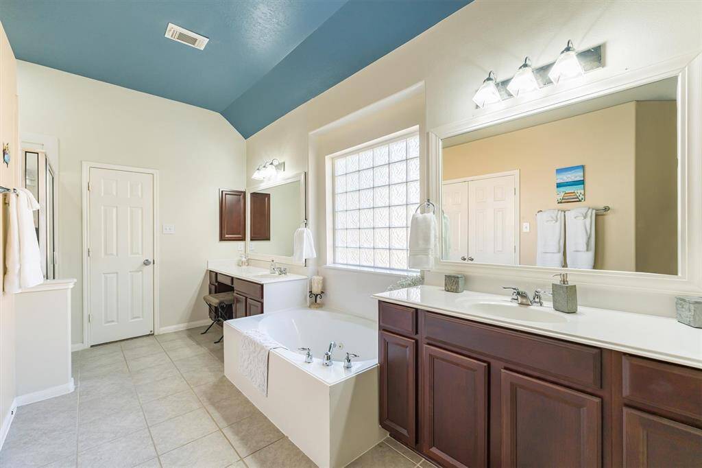 Primary Bathroom with double vanities & Walk-in Shower...