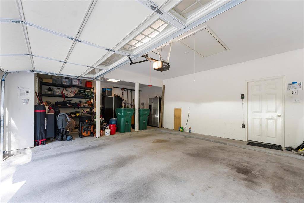 Garage is oversized 2 car garage has extra storage areas...