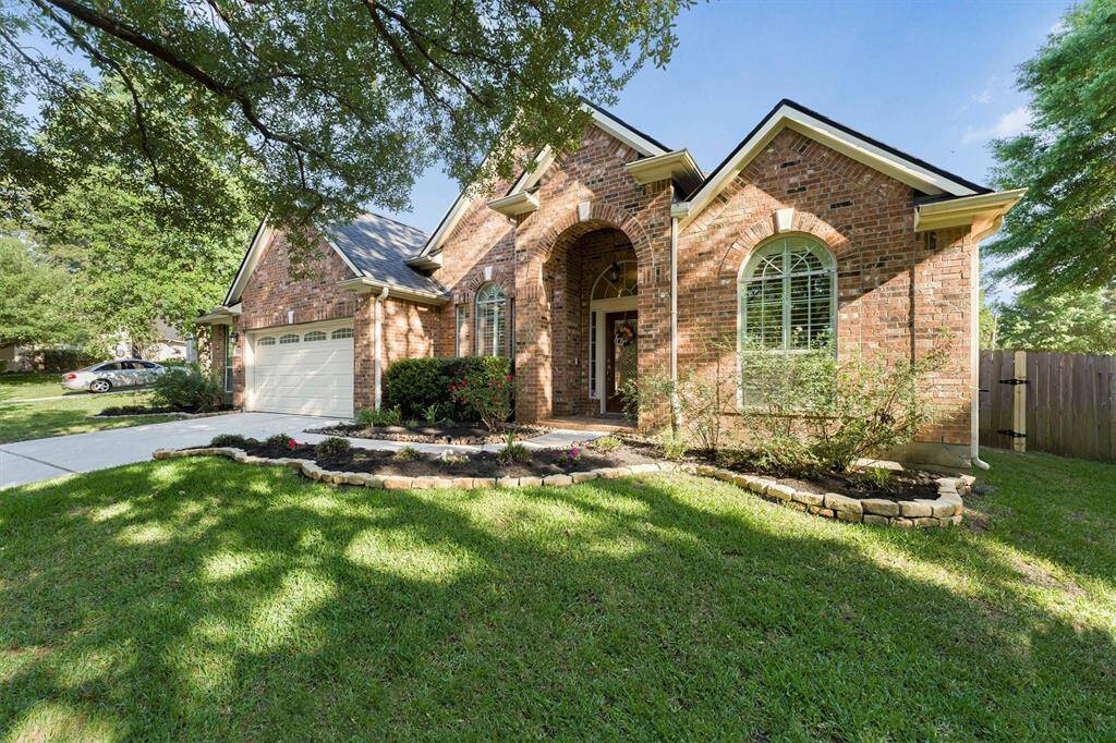 Lush flowerbeds adorn this beautiful home...