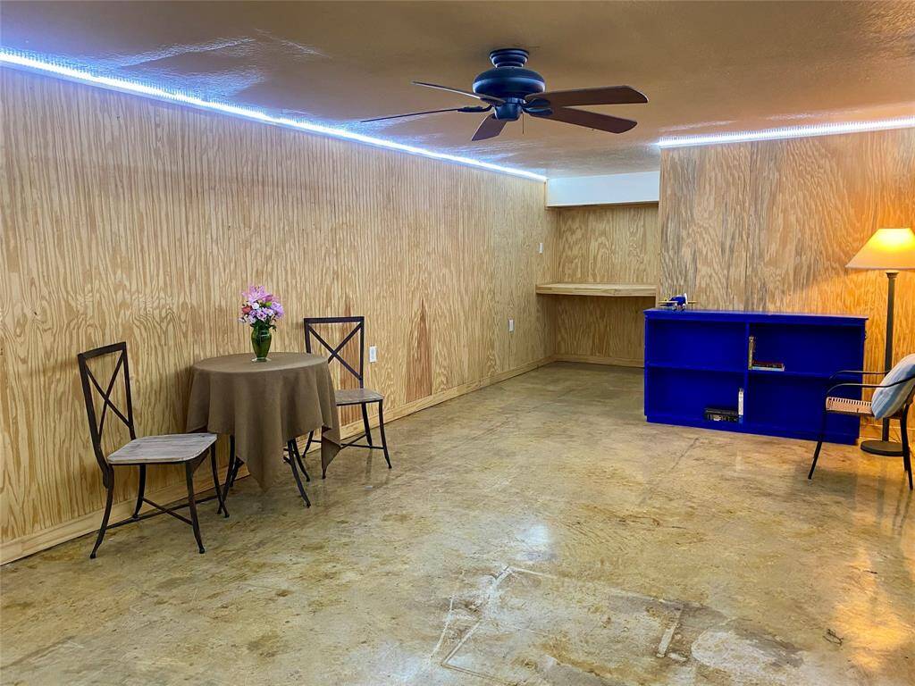 Expansive downstairs bedroom with stained concrete floors can be used as a separate living quarters, game room, or just about anything you can imagine!
