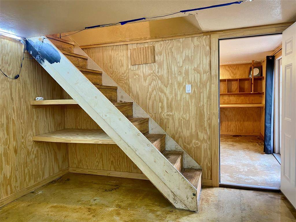 Interior stairs lead up to upstairs hallway
