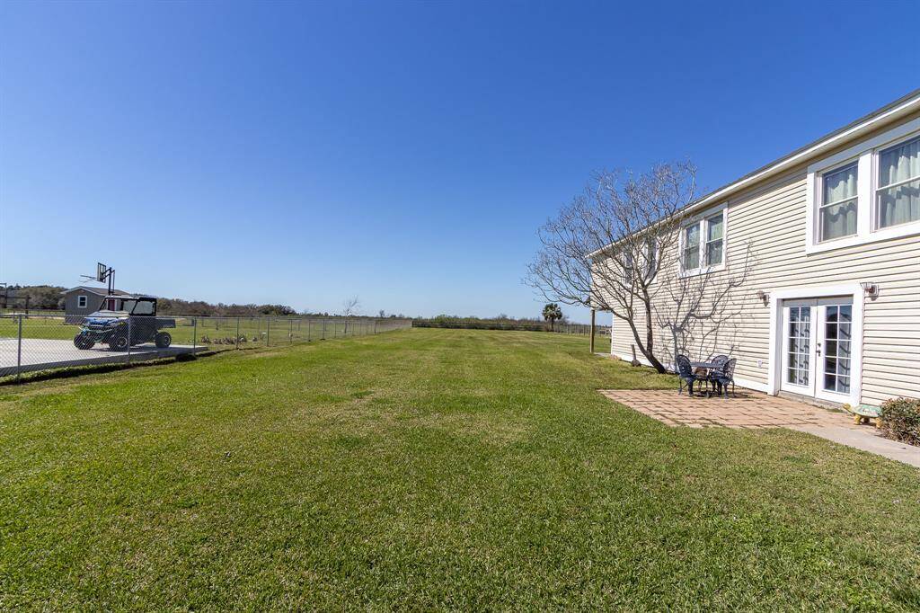 South side view of the property with ample outdoor recreational space.