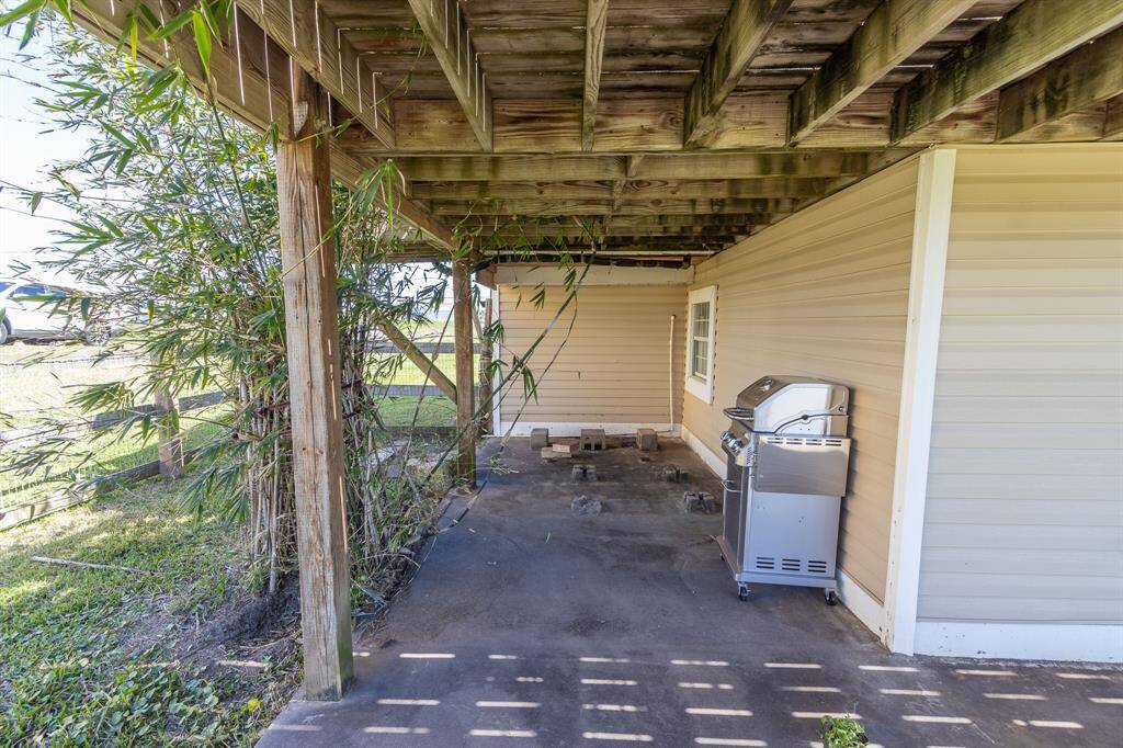 Ground level covered patio on NW side of the home.